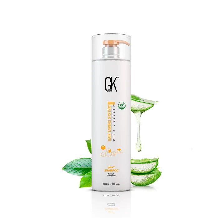 GK Hair pH+ Shampoo 1000 ml white pump bottle with a peach pump, aloe vera leaves and gel dripping behind it
