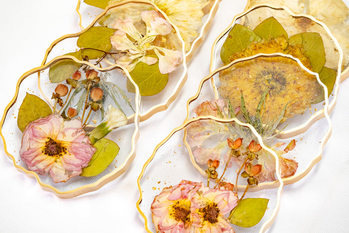 Landscape photo of pressed flower geode coasters with soft dried botanicals in a tablescape