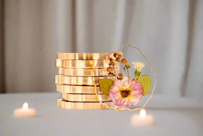 Pressed flower geode coasters with gold edges in a tablescape setting