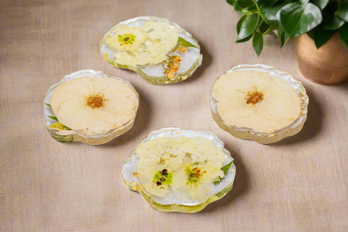 Pressed flower geode coasters with clear edges in a tablescape setting