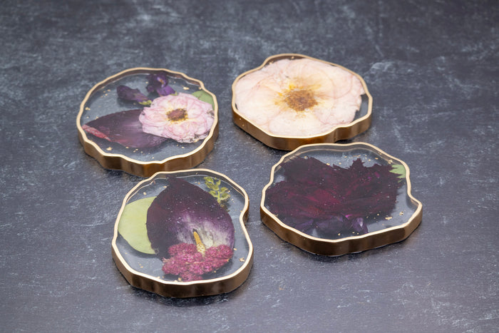 Pressed flower resin coasters in epoxy, showing preserved wedding bouquet flowers