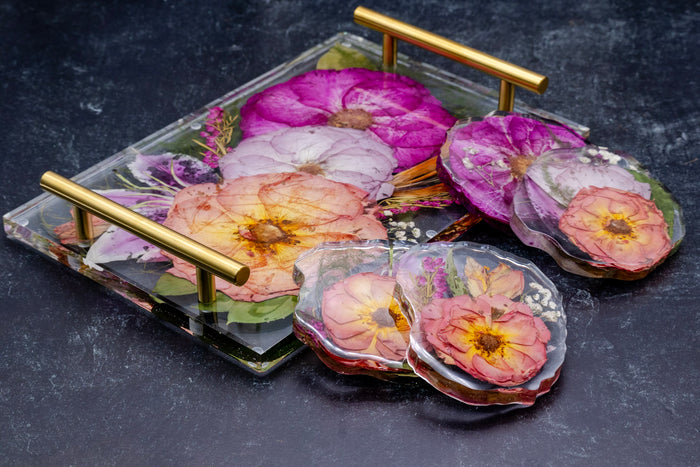 Landscape photo of a pressed flower round coaster set with soft dried roses