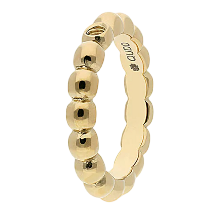 Gold ring with beaded design on a white background