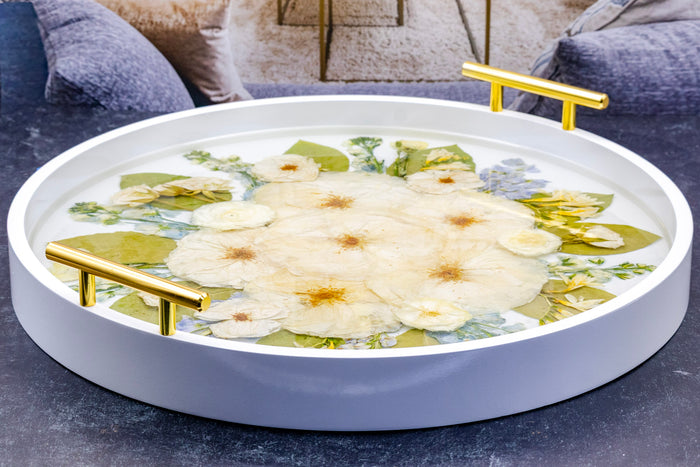 Round Ottoman Tray & Geode Coaster Bundle featuring a floral design in resin with gold handles