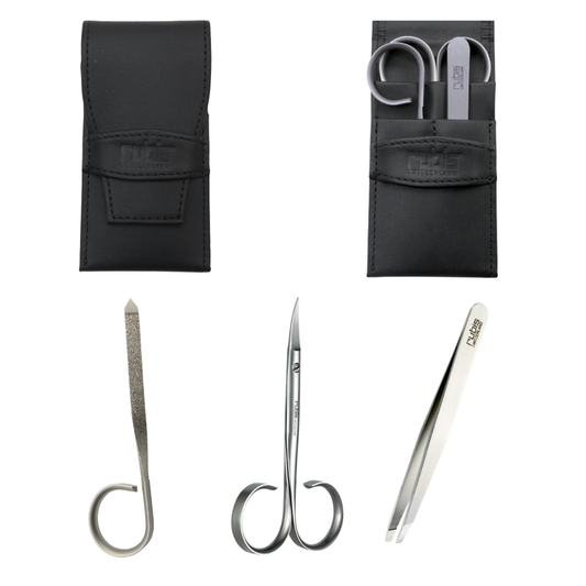 T300 Rubis three beauty tools set in pouch | A set of three silver metal beauty tools with black leather storage pouches on a white background. The tools include a curved nail file, small manicure scissors, and tweezers, all branded with the Rubis logo.