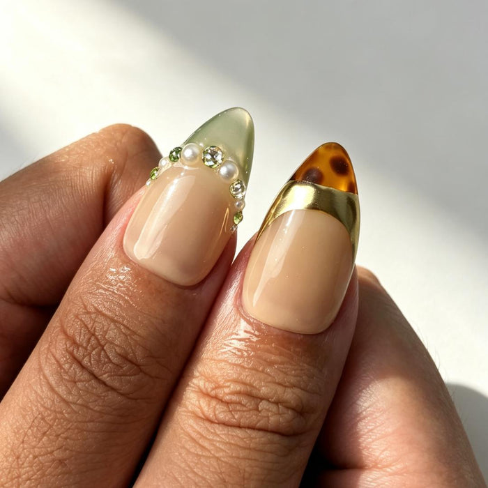 Vintage luxury nude green gold fake nails close‑up