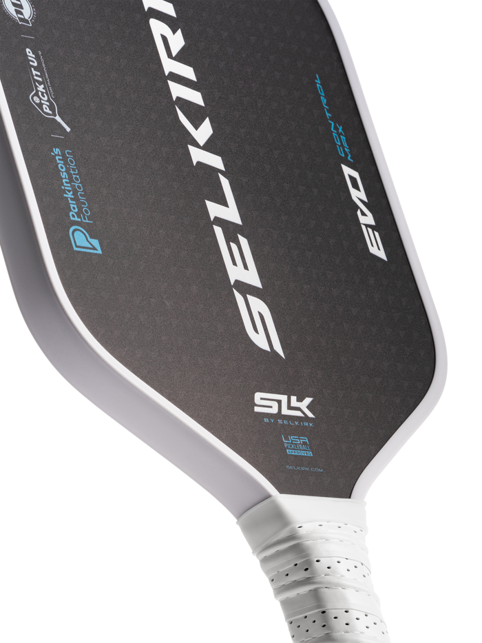 Selkirk paddle showing SELKIRK; SLK; BY SELKIRK; SELKIRK.COM; EVO; Parkinsons Foundation; PICK IT UP; USA PICKLEBALL