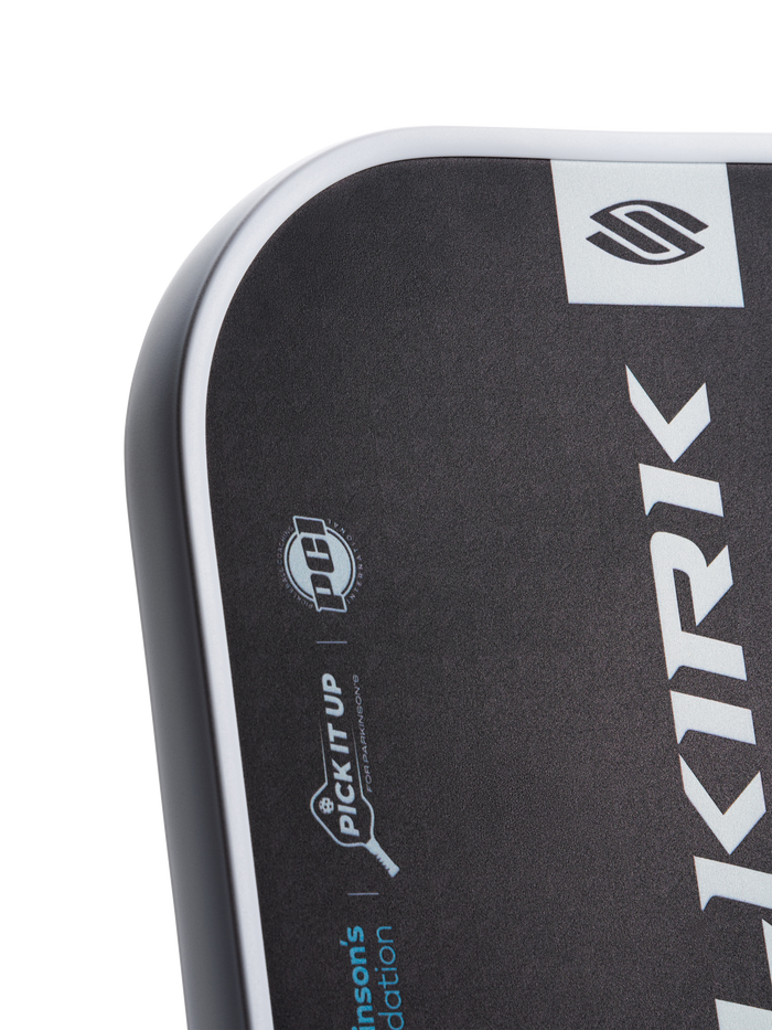 Close-up of paddle edge showing "PICK IT UP" tagline and "KIRK" vertical logo.