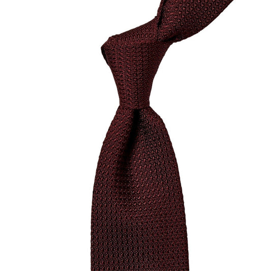 A Sovereign Grade Grenadine Grossa Burgundy Tie on a white background by KirbyAllison.com.
