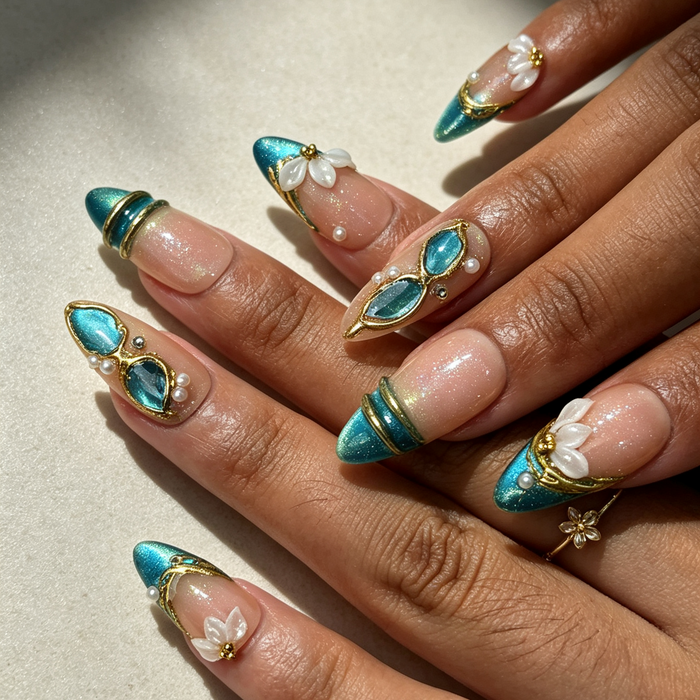 Elegant teal cat‑eye gold framed flower handmade press‑on nails on hand