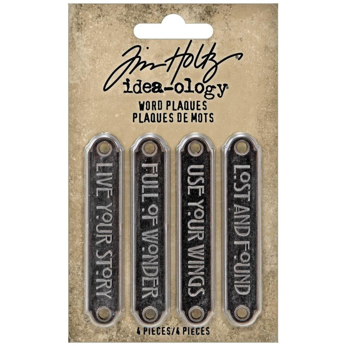 Tim Holtz - Idea-Ology - Metal Word Plaques - 4/Pkg. Tim Holtz Word Plaques are metal labels that feature unique raised words on each. Simply adhere or use Tim Holtz fasteners for an expressive label on your next make. Word Plaques by Tim Holtz are decorative metal labels with raised words. Available at Embellish Away located in Bowmanville Ontario Canada.