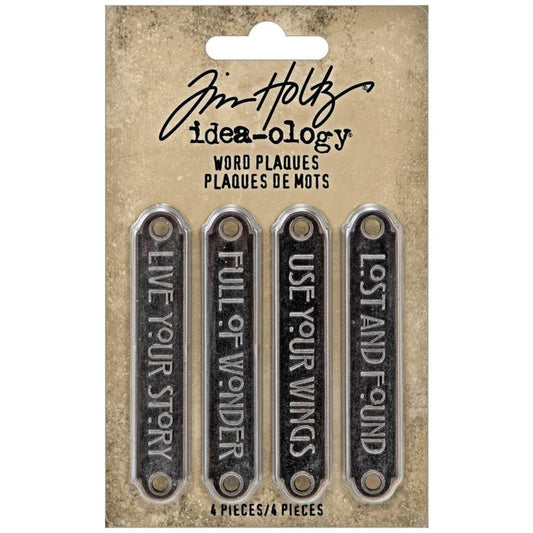 Tim Holtz - Idea-Ology - Metal Word Plaques - 4/Pkg. Tim Holtz Word Plaques are metal labels that feature unique raised words on each. Simply adhere or use Tim Holtz fasteners for an expressive label on your next make. Word Plaques by Tim Holtz are decorative metal labels with raised words. Available at Embellish Away located in Bowmanville Ontario Canada.