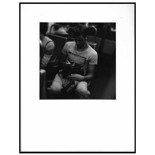 black and white photo of guy with iPod