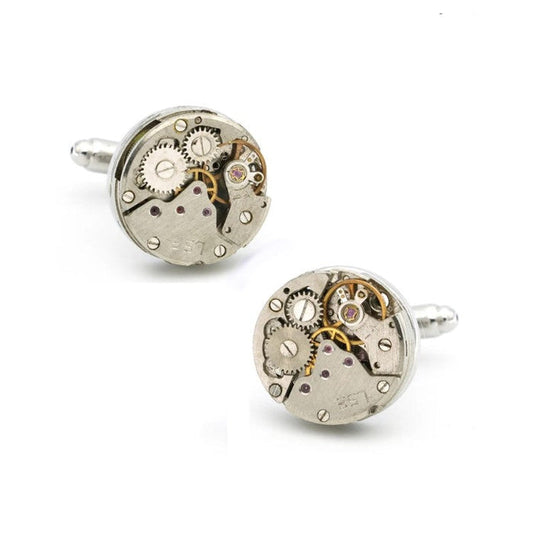 Vintage mechanical watch movement cufflinks with intricate silver and gold gears on silver-plated backings.