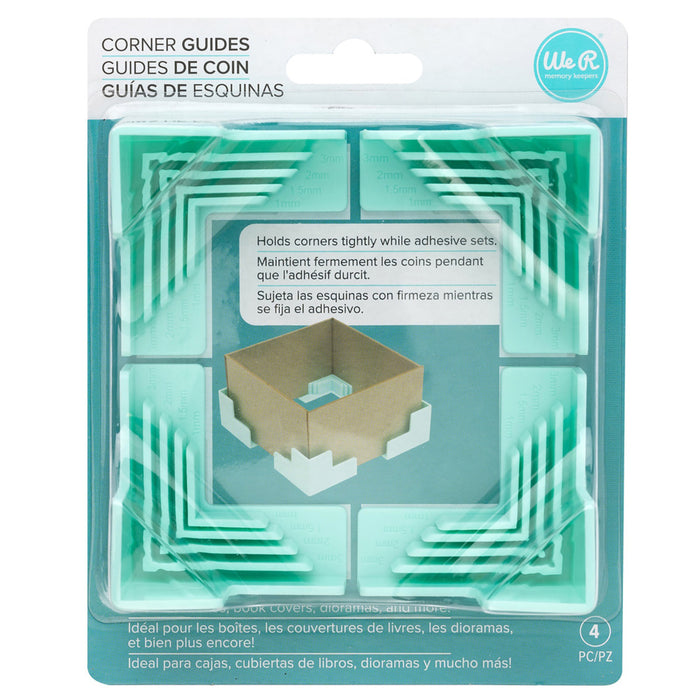 We R Memory - Corner Guides - 4/Pkg. Great for boxes, book covers, dioramas, and more! Holds corners tightly while adhesive sets. Works with 3mm, 2mm, 1.5mm, and 1mm wide chipboard. Imported. Available at Embellish Away located in Bowmanville Ontario Canada.